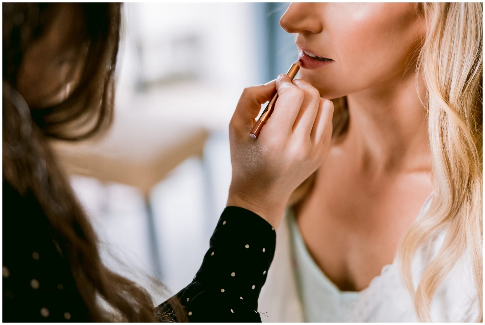 Bride having her make up done ready for her wedding.