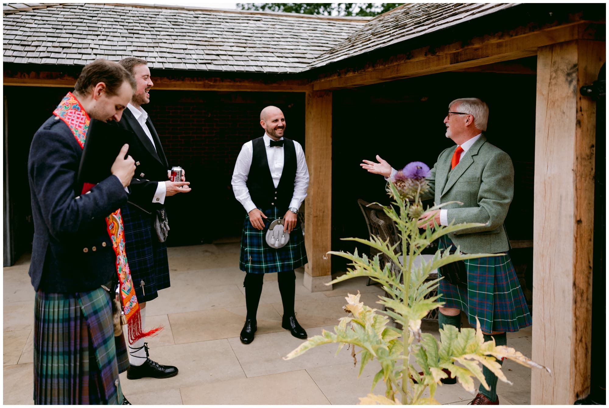 groomsmen chatting before the ceremony at wilderness reserve suffolk